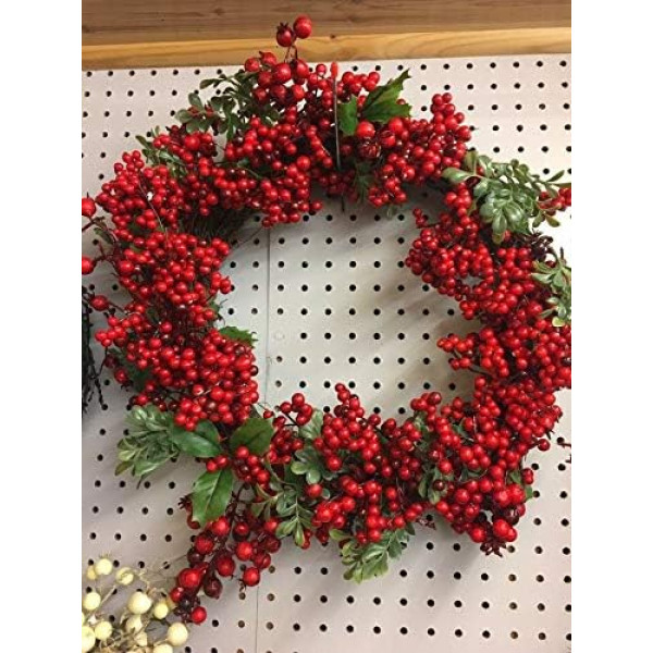 Weihnachtskranz mit roten Beeren, mit grünen Blüten